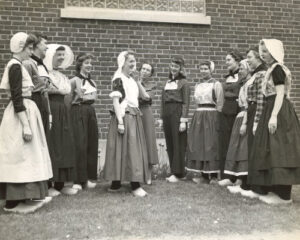 A picture of Lavina Cappon and Tulip Time Klompen Dancers (1965), which is the focus of the Holland Museum exhibit, " A Stitch in Time: Lavina Cappon's Tulip Time Legacy," on display from April 26-September 16, 2024.